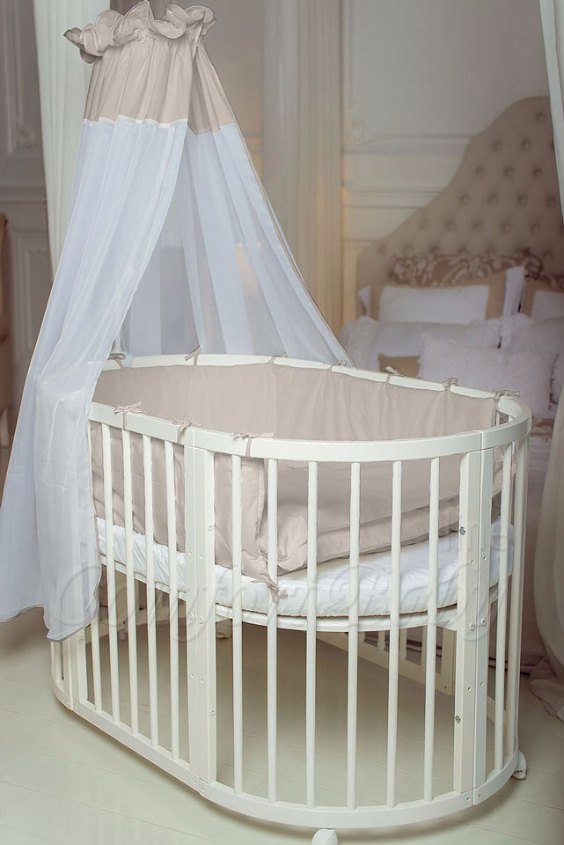КРОВАТКА- ТРАНСФОРМЕР "COMFORT BABY" .Цена: 25 000 руб.  ХАРАКТЕРИСТИКИ:  возраст детей: 0-5 лет  габариты модели (Д х Ш х В): 1) колыбельки: 78*76*81 см  2) овальной кроватки: 128*76*81 cм  матрас приобретается отдельно.  максимальная нагрузка: 120 кг  Материал: изготавливается только из настоящего массива бука высшего сорта.  сборка: кровать в разобранном виде, простота сборки, инструкция по сборке на русском языке  продукция сертифицирована  производство: Россия  гарантия: 2 года   Дополнительные характеристики: 4 положения по высоте (расстояние положения дна от пола без колес: 1см, 12см, 37см, 57см; расстояние между отверстиями снизу-наверх: 12см, 15см, 20см.); 3 прутика - съемные.  КОНМПЛЕКТАЦИЯ:  1-я ступень - круглая кроватка  2-я ступень - овальная кроватка  3-я ступень - диванчик  4-я ступень - манеж  5-я и 6-я ступени - 2 кресла и столик  7-я ступень - пеленальный столик  ДОПОЛНИТЕЛЬНЫЕ ОПЦИИ:  Комплект постельный "Classic" +6950 руб.  Комплект постельный "Colorit" + 11990 руб.  Фирменный держатель для балдахина +790 руб.  Комплект цельных матрасов " Холкон"/ "Кокос" (круглый+овальный) +8490 руб  Маятник "ComfortBaby Pendulum" 2 в 1+6990 руб.