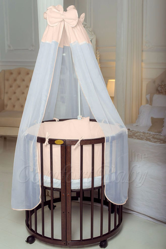 КРОВАТКА- ТРАНСФОРМЕР "COMFORT BABY" .Цена: 25 000 руб.  ХАРАКТЕРИСТИКИ:  возраст детей: 0-5 лет  габариты модели (Д х Ш х В): 1) колыбельки: 78*76*81 см  2) овальной кроватки: 128*76*81 cм  матрас приобретается отдельно.  максимальная нагрузка: 120 кг  Материал: изготавливается только из настоящего массива бука высшего сорта.  сборка: кровать в разобранном виде, простота сборки, инструкция по сборке на русском языке  продукция сертифицирована  производство: Россия  гарантия: 2 года   Дополнительные характеристики: 4 положения по высоте (расстояние положения дна от пола без колес: 1см, 12см, 37см, 57см; расстояние между отверстиями снизу-наверх: 12см, 15см, 20см.); 3 прутика - съемные.  КОНМПЛЕКТАЦИЯ:  1-я ступень - круглая кроватка  2-я ступень - овальная кроватка  3-я ступень - диванчик  4-я ступень - манеж  5-я и 6-я ступени - 2 кресла и столик  7-я ступень - пеленальный столик  ДОПОЛНИТЕЛЬНЫЕ ОПЦИИ:  Комплект постельный "Classic" +6950 руб.  Комплект постельный "Colorit" + 11990 руб.  Фирменный держатель для балдахина +790 руб.  Комплект цельных матрасов " Холкон"/ "Кокос" (круглый+овальный) +8490 руб  Маятник "ComfortBaby Pendulum" 2 в 1+6990 руб.